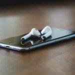 silver iphone 6 on brown wooden table